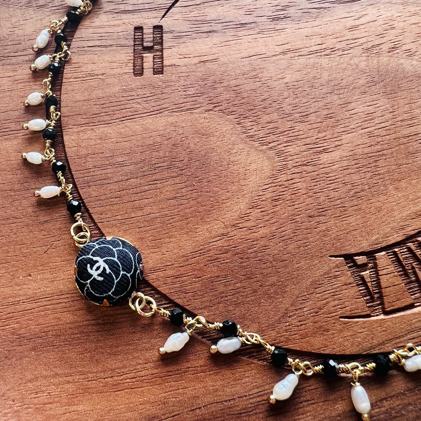 CC- Black & White Camellias with CC logo CC039- genuine pearl & onyx bracelet